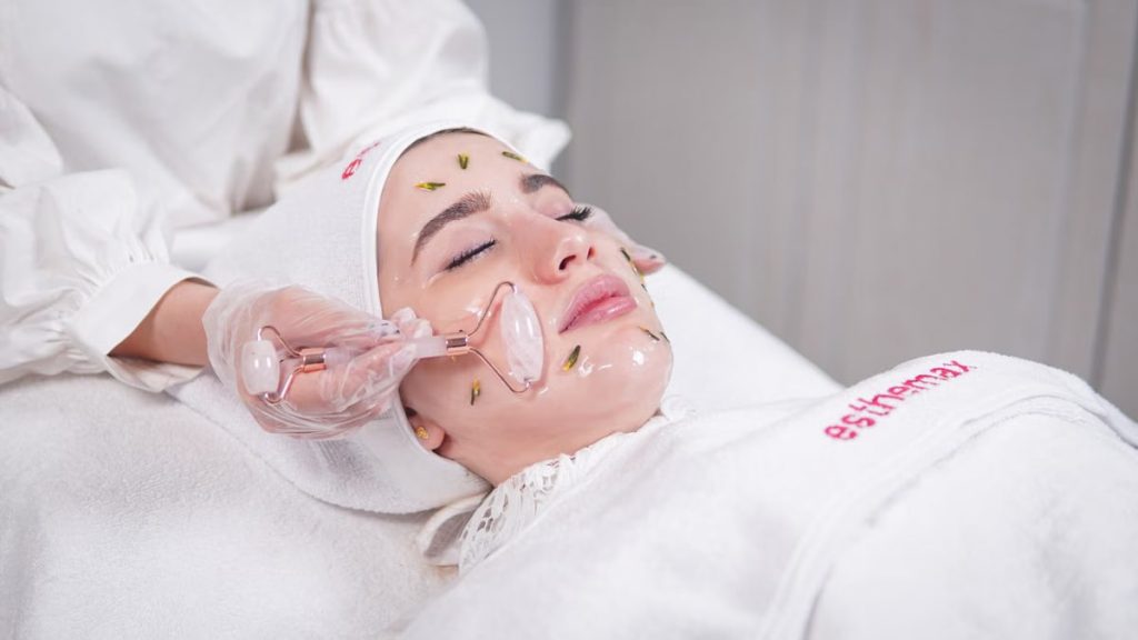 Pampering facial treatment using a roller for skin rejuvenation and relaxation.