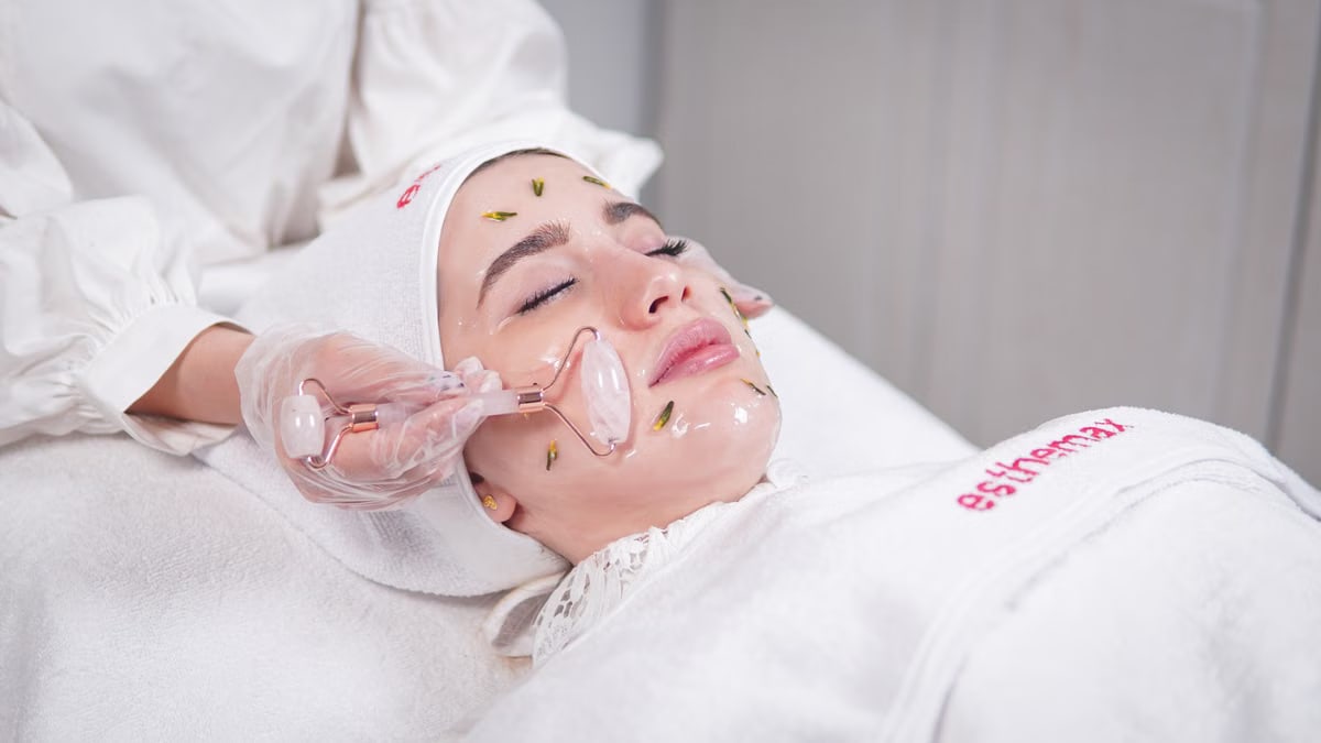 Pampering facial treatment using a roller for skin rejuvenation and relaxation.